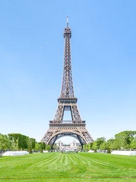 Eiffel Tower with green lawns, Paris, France.