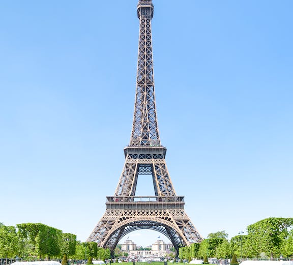 Eiffel Tower with green lawns, Paris, France.