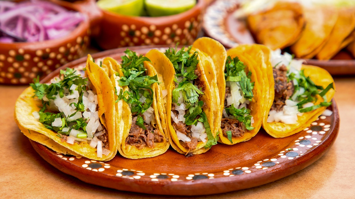Tacos with cilantro and onions on a plate