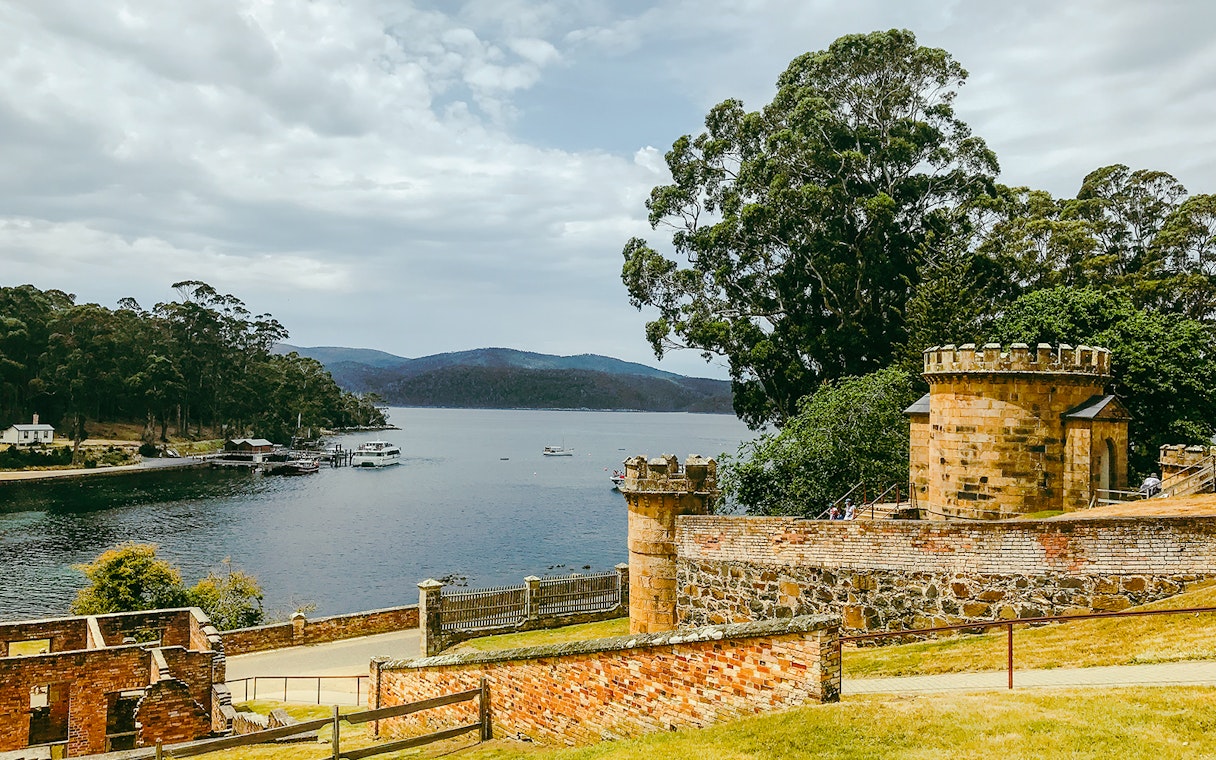 Port Arthur historic site with waterfront view and stone structures, Tasmania.