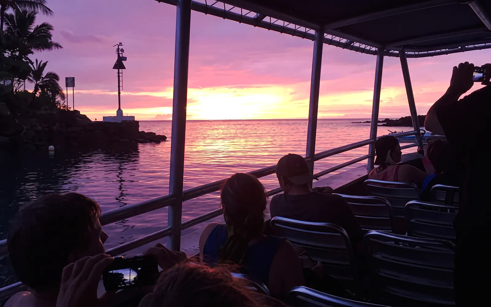 Boat at sunset on Big Island Manta Ray Night Snorkel tour.