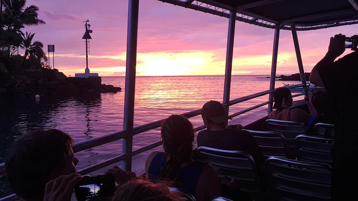 Boat at sunset on Big Island Manta Ray Night Snorkel tour.