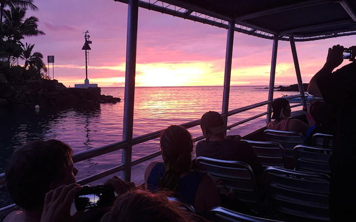 Boat at sunset on Big Island Manta Ray Night Snorkel tour.