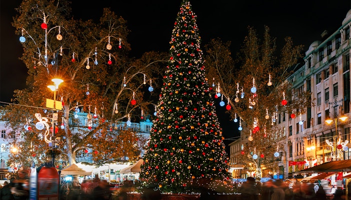 Christmas tree and festive lights at Vörösmarty Square Christmas Fair, Budapest, Hungary.