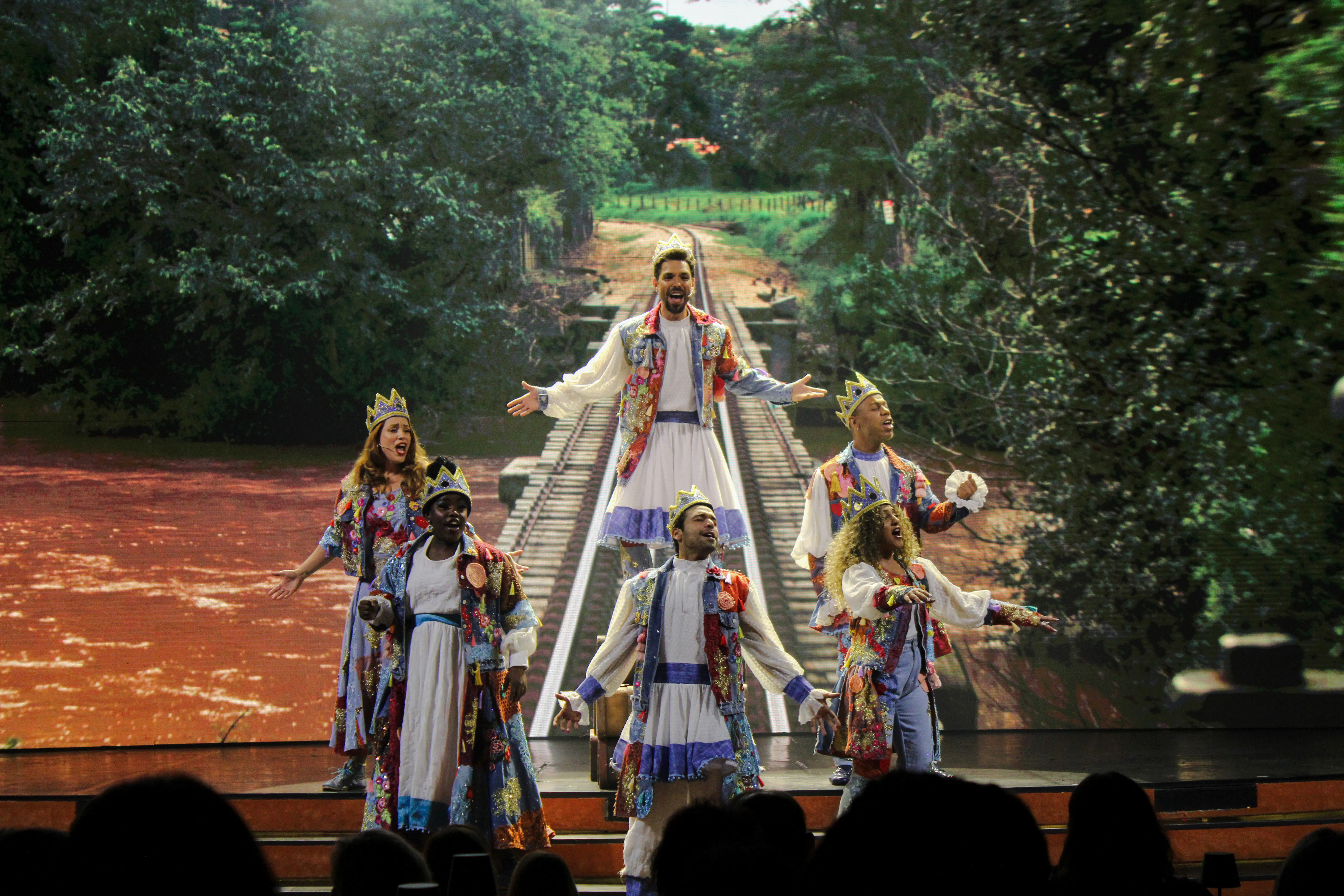 Performers in colorful costumes on stage at Roxy Dinner Show, Rio de Janeiro.
