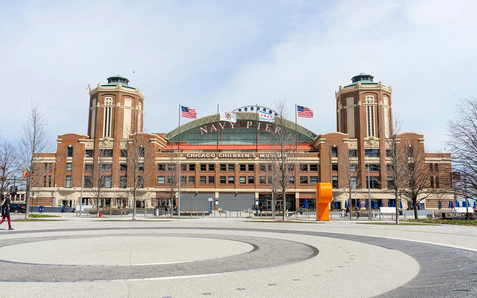 Navy Pier entrance with flags, Chicago Children's Museum sign, Chicago.