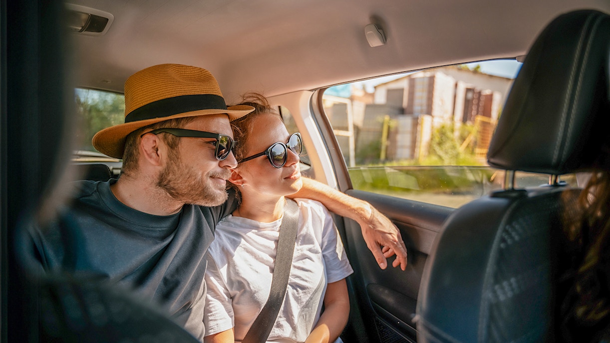 Tourists in a car enjoying a scenic drive, part of Similan Islands tour with hotel transfers.