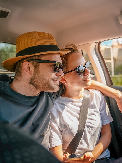 Tourists in a car enjoying a scenic drive, part of Similan Islands tour with hotel transfers.