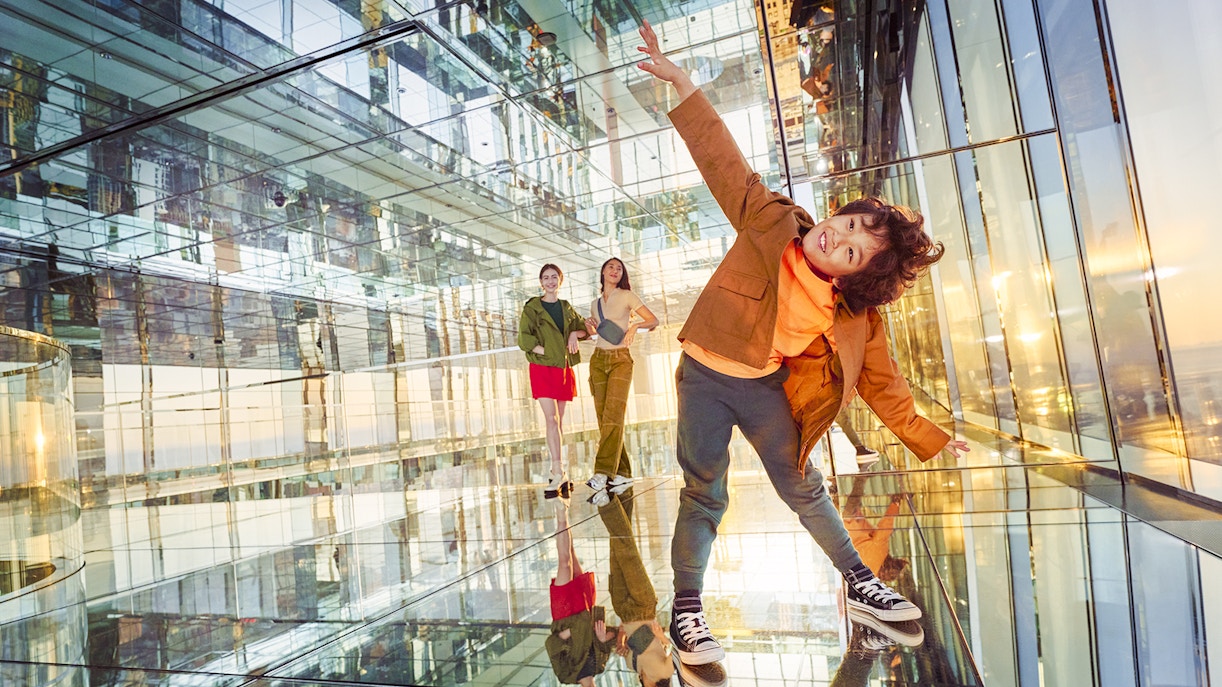 A child posing, enjoying the thrill of the heights at AIR