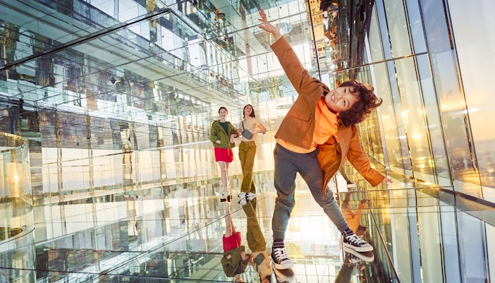 A child posing, enjoying the thrill of the heights at AIR