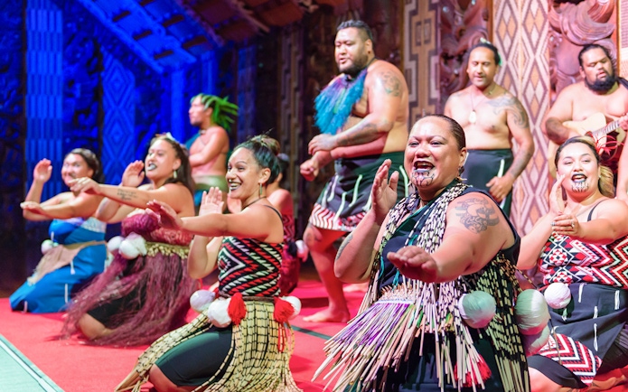 Cultural performance at Waitangi Treaty Grounds with traditional Maori attire.