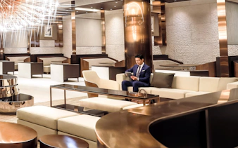 Man seated in Matina Gold lounge, Terminal 2, Incheon International Airport.
