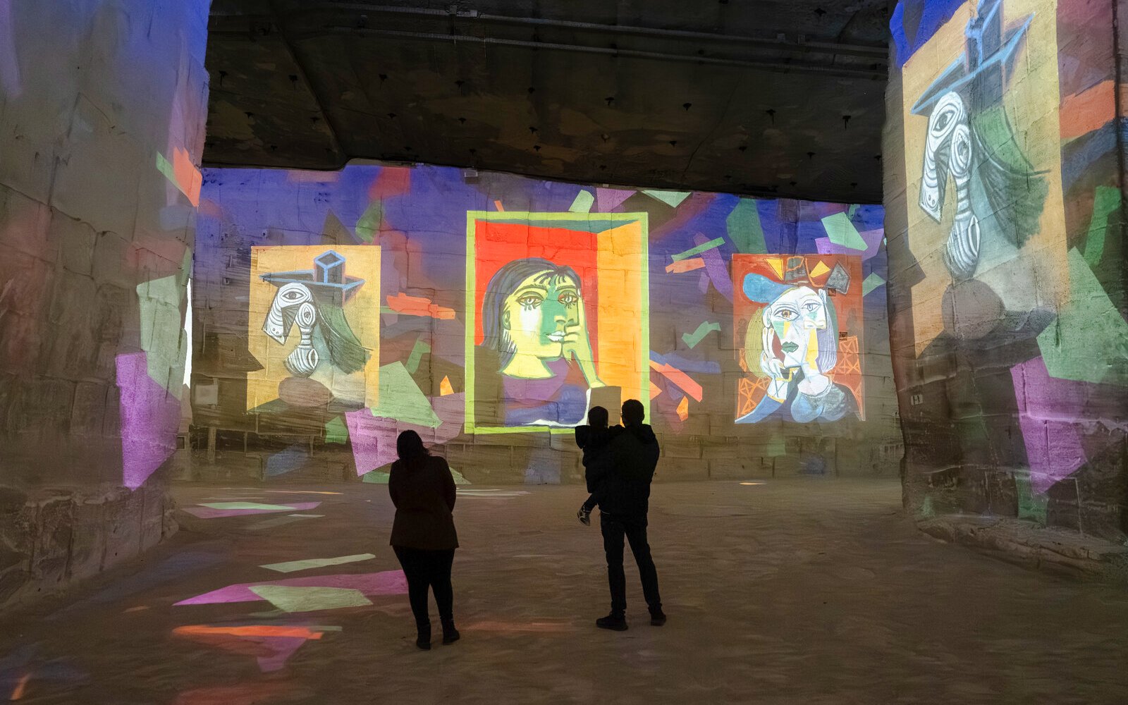 Picasso artworks projected on walls at Carrières des Lumières exhibit.