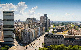 Buenos Aires cityscape with Avenida de Mayo, featuring historic architecture and urban skyline.