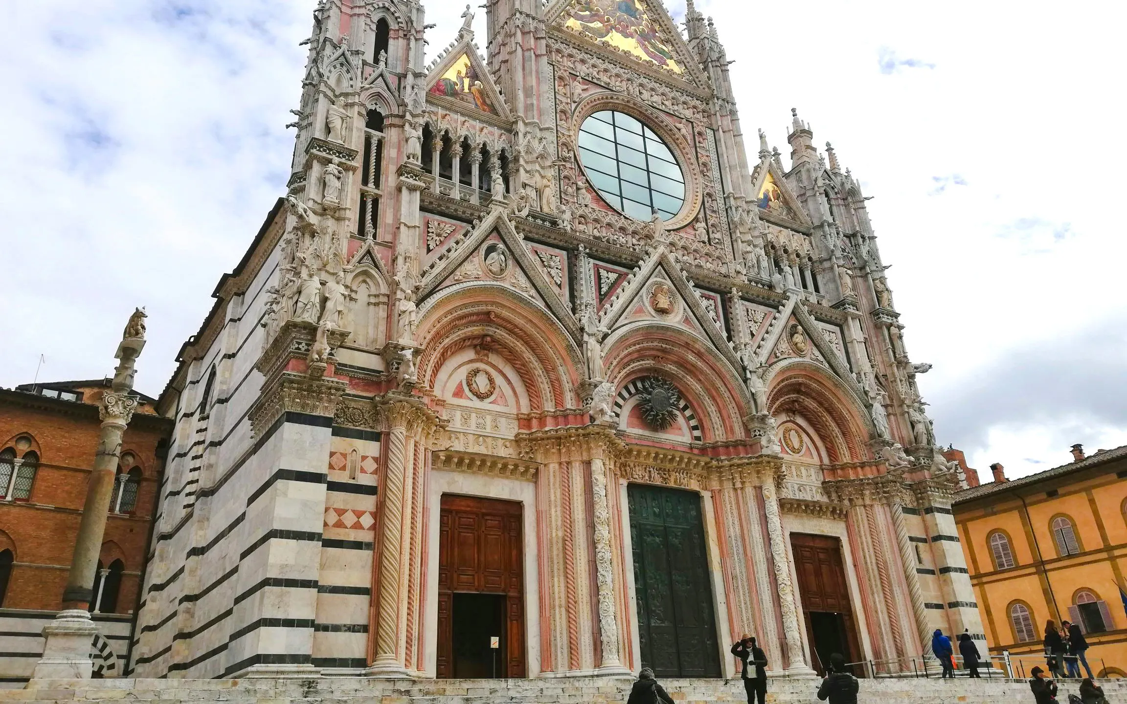 Siena Cathedral facade with intricate Gothic architecture in Tuscany, Italy.
