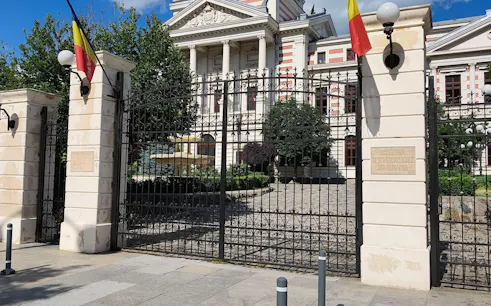 Wrought iron gate in front of Colțea Hospital, Bucharest, part of self-guided city exploration game.