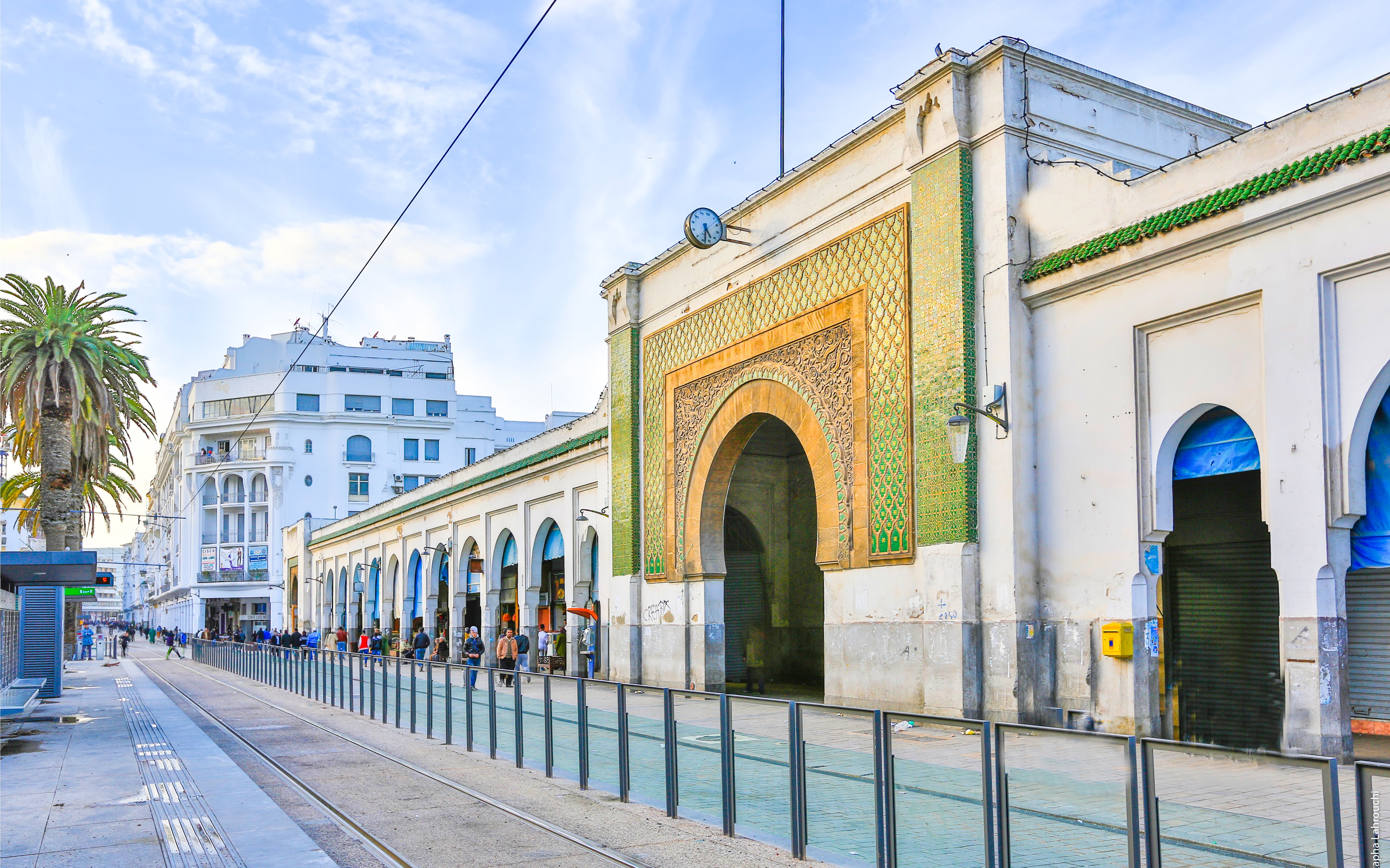 Marche Central entrance with ornate archway and tram tracks, Casablanca, Morocco.