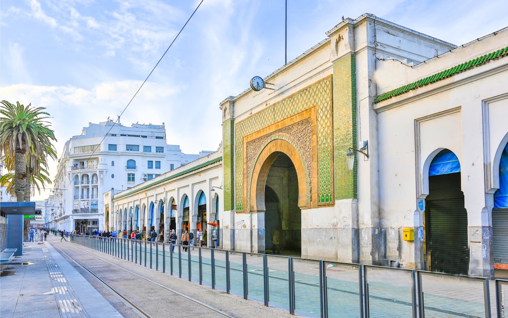 Marche Central entrance with ornate archway and tram tracks, Casablanca, Morocco.