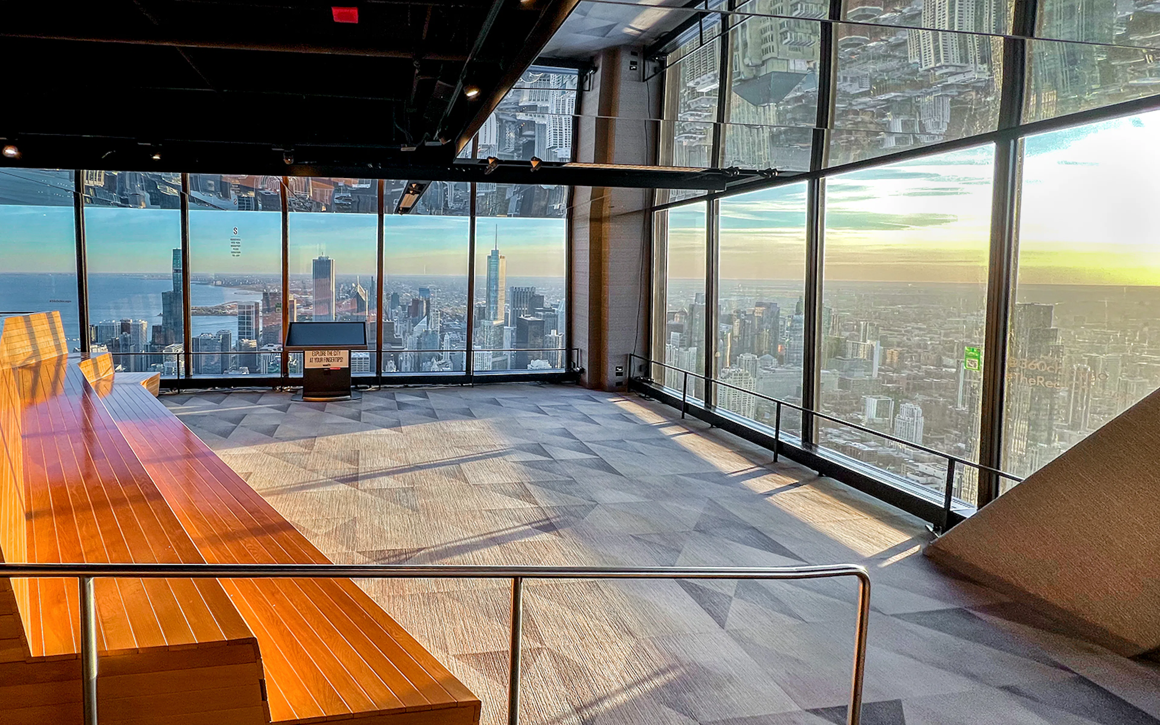Chicago skyline from 360 Observation Deck with lake and skyscrapers in view.
