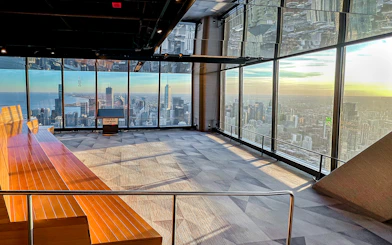 Chicago skyline from 360 Observation Deck with lake and skyscrapers in view.