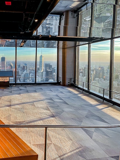 Chicago skyline from 360 Observation Deck with lake and skyscrapers in view.