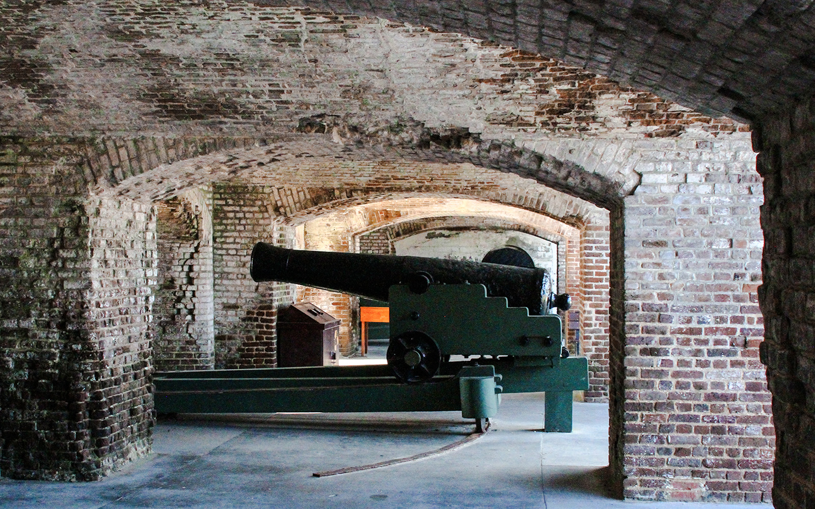 Cannon inside Fort Sumter National Monument brick archway.