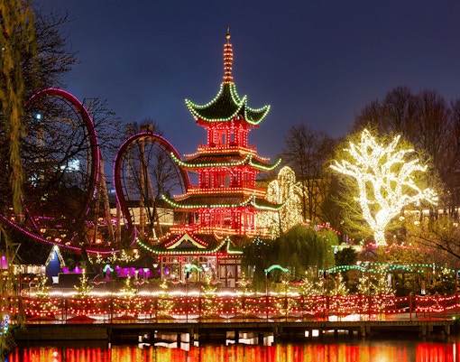 Tivoli Gardens entrance with colorful lights in Copenhagen, Denmark.