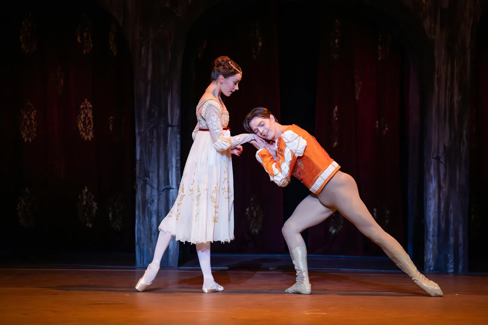 Australian Ballet dancers perform a scene from Romeo and Juliet on stage.