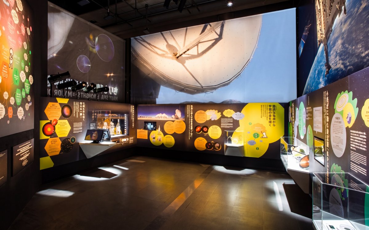 Miraikan permanent exhibition showcasing space exploration displays and interactive panels.
