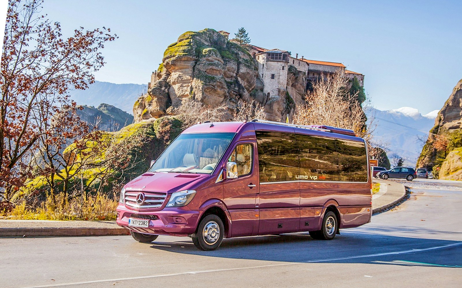 Tour bus in front of Meteora Monasteries, Greece, during a guided day trip from Athens.