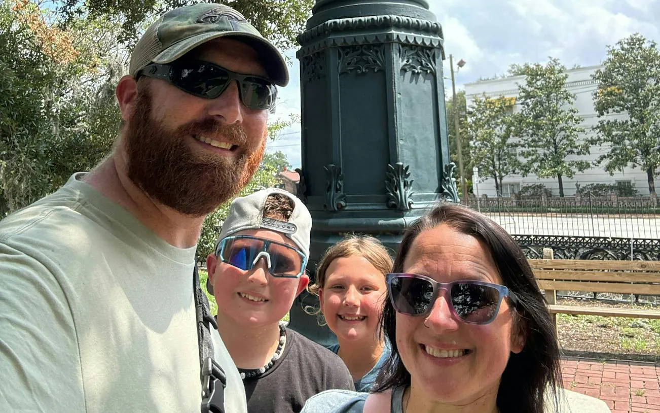 Family enjoying Savannah Captured by Pirates city exploration game in Savannah park.