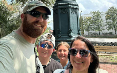Family enjoying Savannah Captured by Pirates city exploration game in Savannah park.