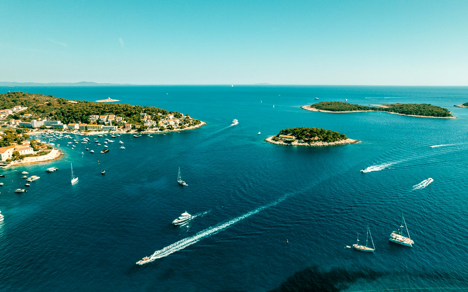 Aerial view of Pakleni Islands, Croatia, showcasing lush greenery and turquoise waters.