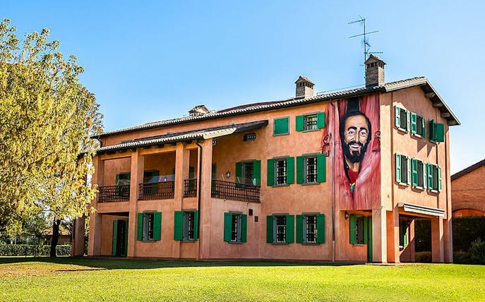 Luciano Pavarotti House Museum exterior with mural in Modena, Italy.