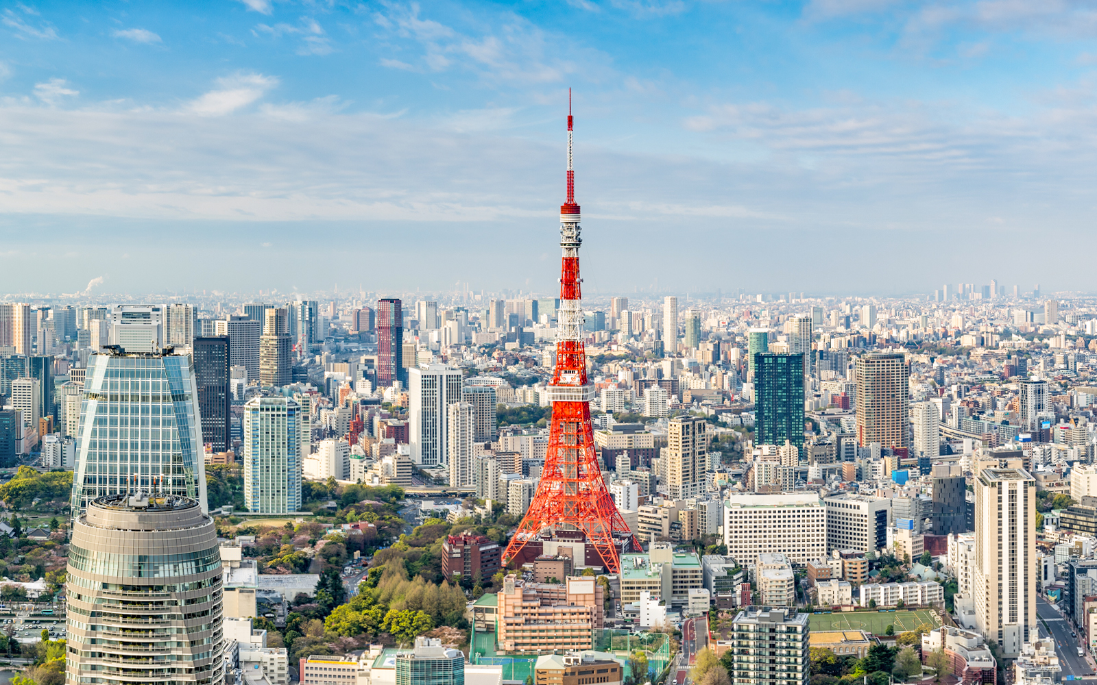 Tokyo Tower amidst city skyline in Tokyo, Japan.