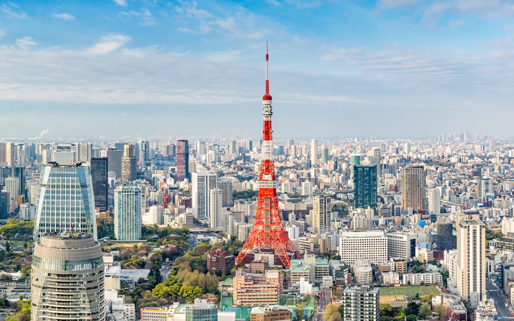 Tokyo Tower amidst city skyline in Tokyo, Japan.