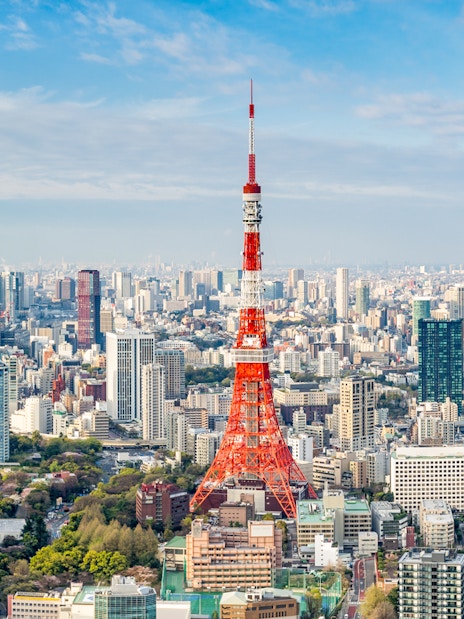 Tokyo Tower amidst city skyline in Tokyo, Japan.