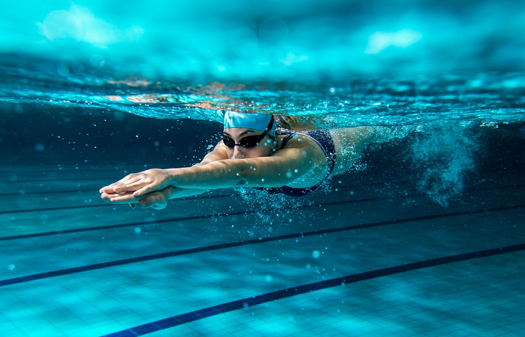 Centre Aquatique indoor swimming pool with lanes and diving boards in Paris, France.