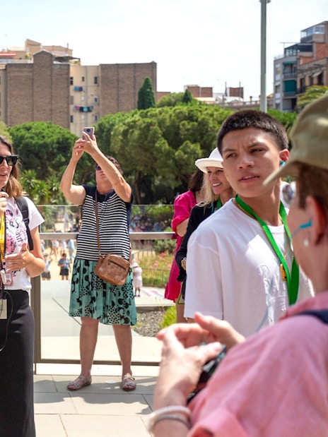 Tour guide leading a group at Sagrada Familia, Barcelona.