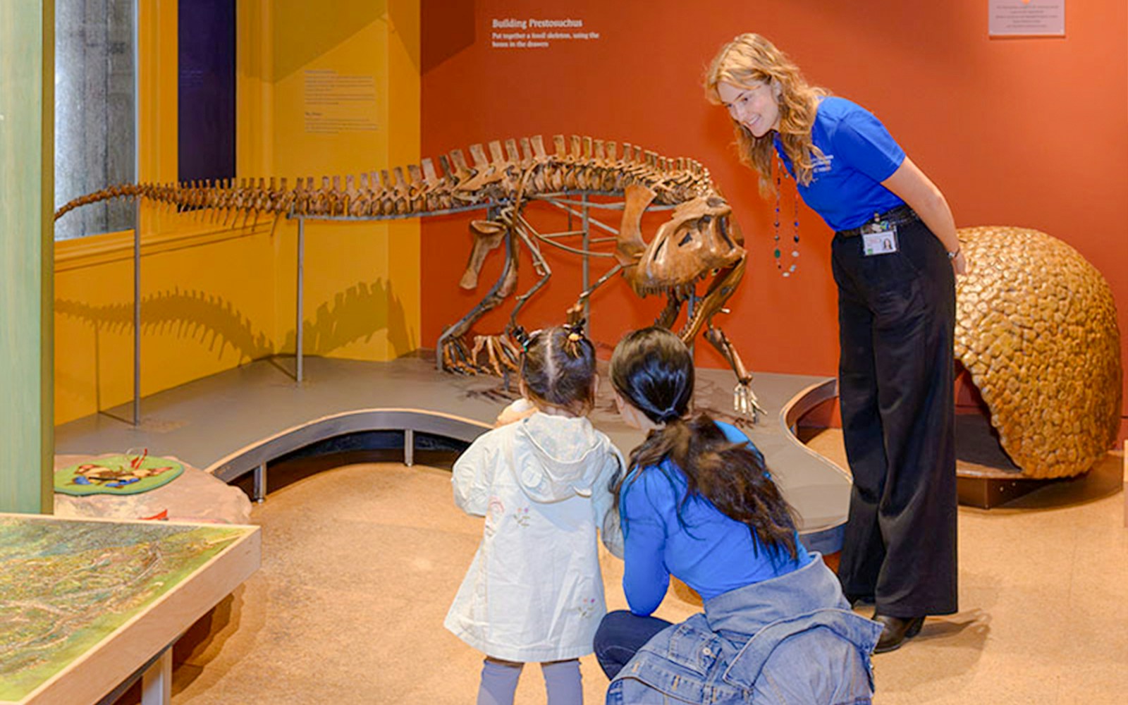 Children exploring exhibits in the American Museum of Natural History Discovery Room, New York City.