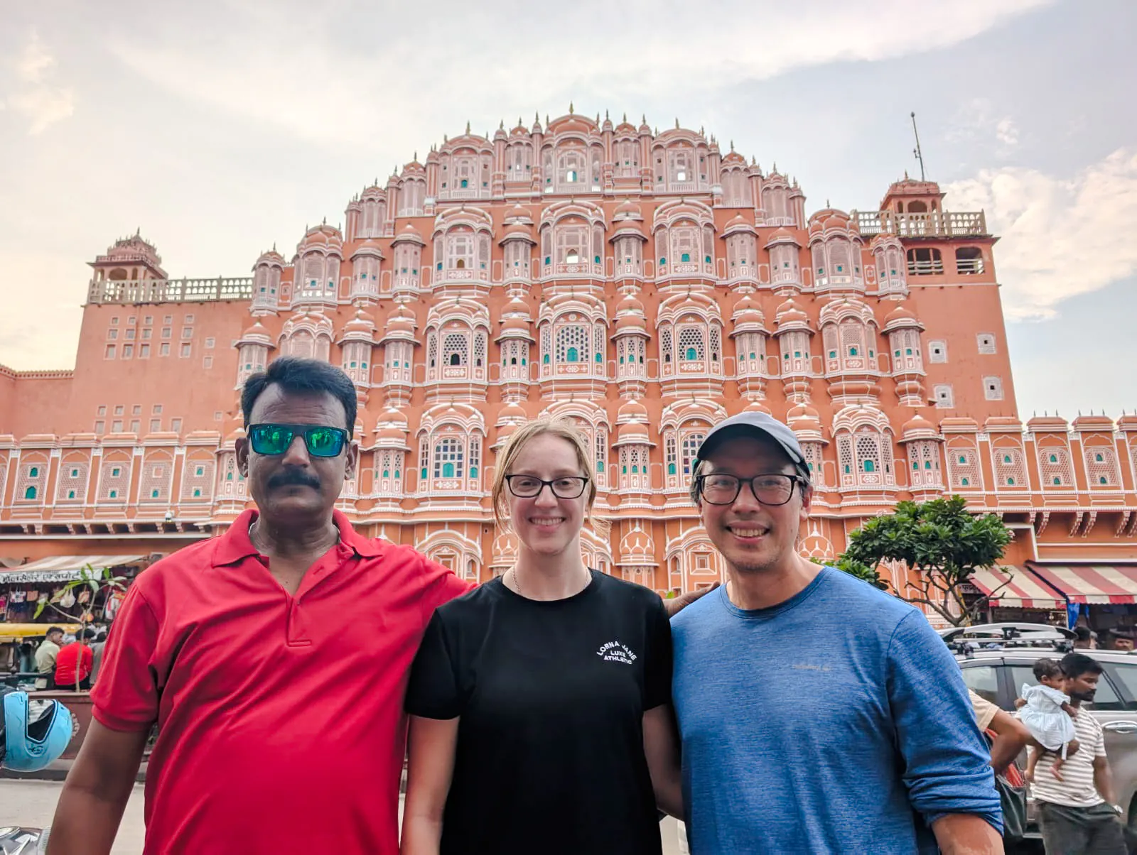 Hawa Mahal facade in Jaipur with tourists on the India Golden Triangle tour.