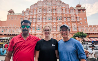 Hawa Mahal facade in Jaipur with tourists on the India Golden Triangle tour.