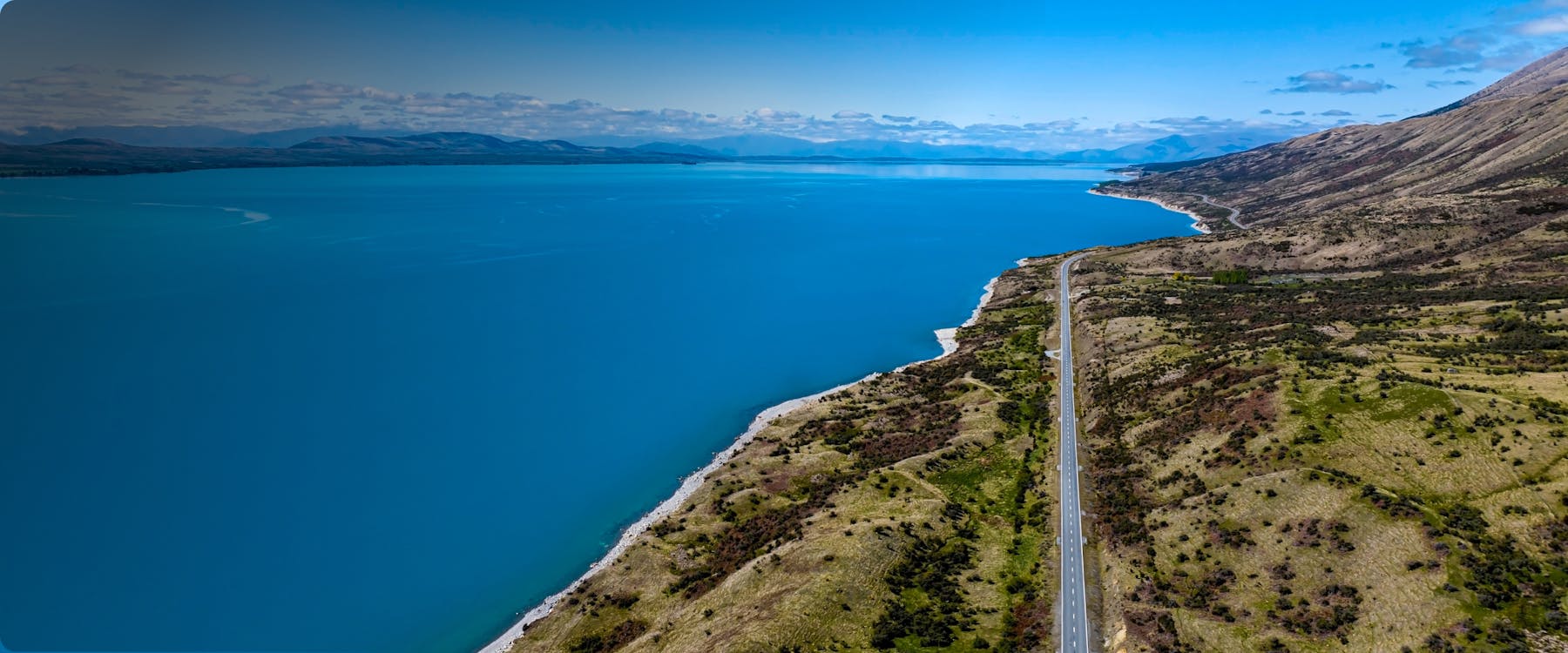 Aerial view of Lake Pukaki and road leading to Mount Cook, New Zealand.