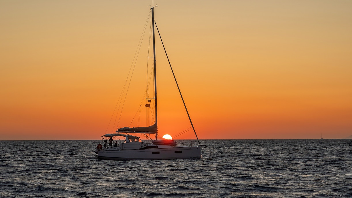 Sailboat on the Aegean Sea during a Santorini sunset cruise.
