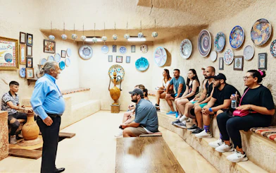 Pottery workshop demonstration in Avanos with visitors observing handcrafted ceramics.