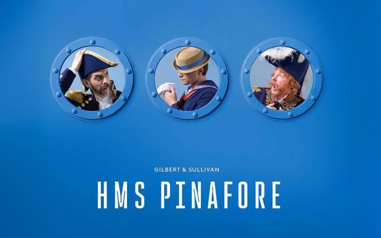 Three characters in naval attire seen through portholes, promoting HMS Pinafore.