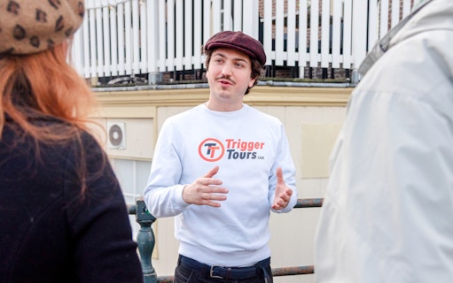 Tour guide speaking to a group during Amsterdam Red Light District walking tour.