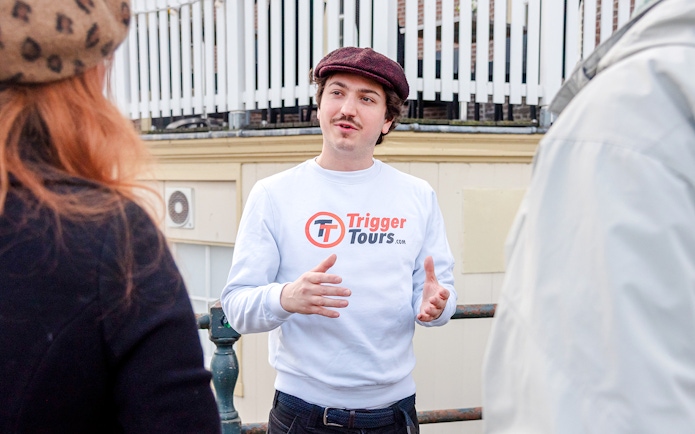 Tour guide speaking to a group during Amsterdam Red Light District walking tour.