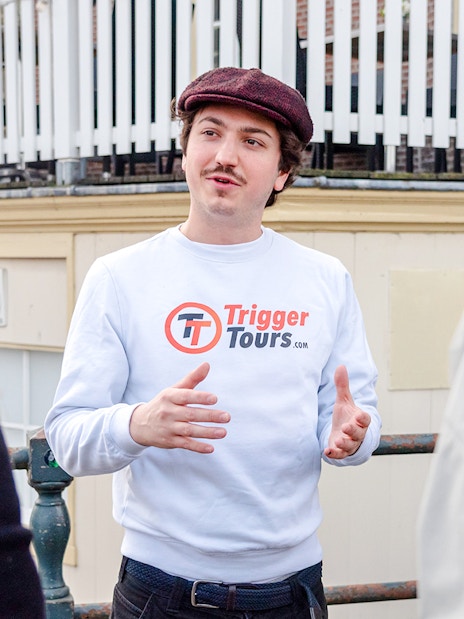 Tour guide speaking to a group during Amsterdam Red Light District walking tour.