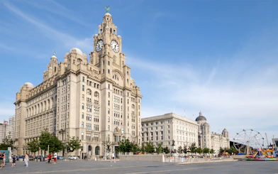 Liver Building and waterfront in Liverpool, United Kingdom, part of hop-on hop-off tour.
